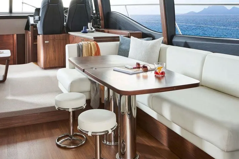 Slide: The Image of Luxurious 2026 Princess S65 Sportbridge yacht interior with city skyline view. - 20