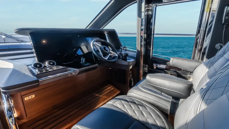Slide: The Image of Luxurious interior of 2026 Princess S65 Sportbridge yacht with modern kitchen and seating area. - 24