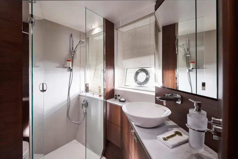 Slide: The Image of Luxurious kitchen interior of 2026 Princess S65 Sportbridge yacht with modern wood cabinetry. - 29