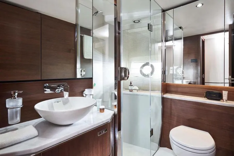 Slide: The Image of Luxurious interior of 2026 Princess S65 Sportbridge yacht with modern kitchen and seating area. - 31