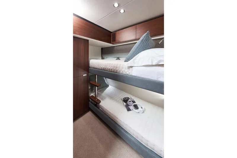 Slide: The Image of Luxurious interior of 2026 Princess S65 Sportbridge yacht with elegant seating and scenic views. - 32