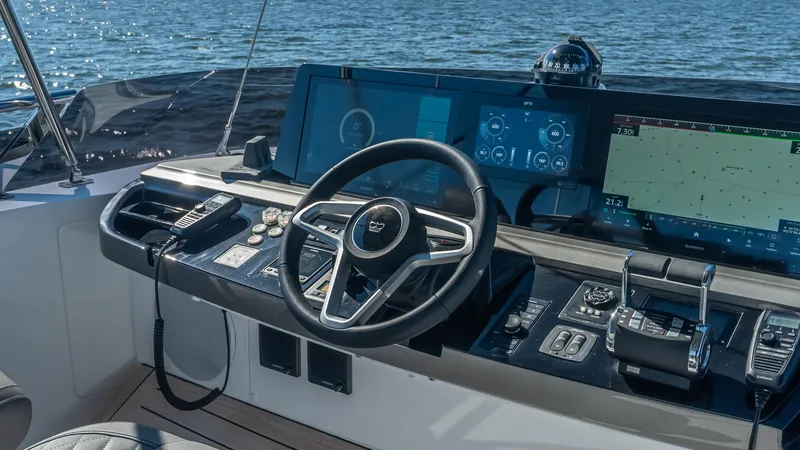 Slide: The Image of Luxurious interior of 2026 Princess S65 Sportbridge yacht with elegant seating and blue decor accents. - 35