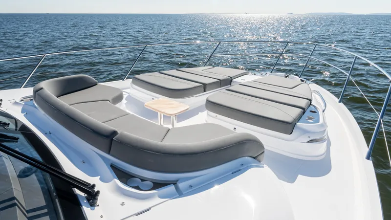 Slide: The Image of Luxurious interior of 2026 Princess S65 Sportbridge yacht with plush seating and scenic ocean view. - 38