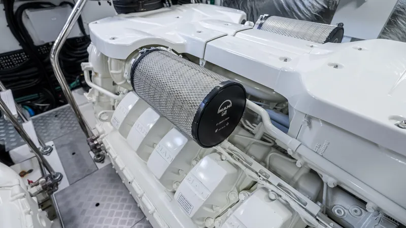 Slide: The Image of Luxurious wood interior of 2026 Princess S65 Sportbridge yacht with built-in mini fridge. - 47