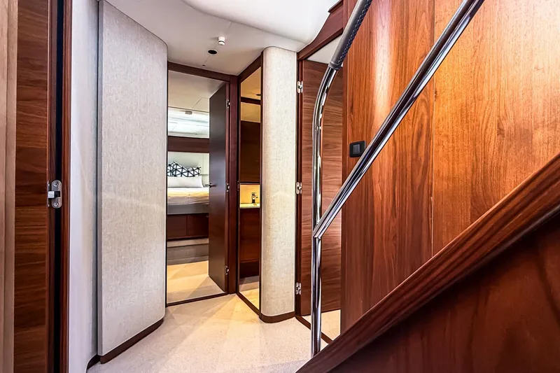 Slide: The Image of Luxurious interior of 2026 Princess S65 Sportbridge yacht with wooden finishes and modern design. - 54