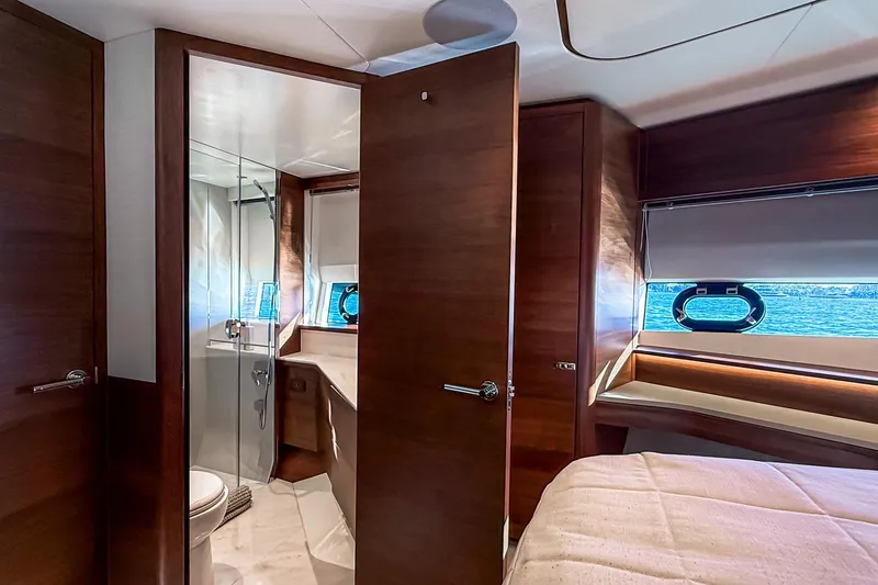 Slide: The Image of Luxurious interior of 2026 Princess S65 Sportbridge yacht with elegant wood finishes. - 66