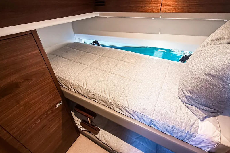 Slide: The Image of Cozy cabin interior of 2026 Princess S65 Sportbridge yacht with a comfortable bed. - 73