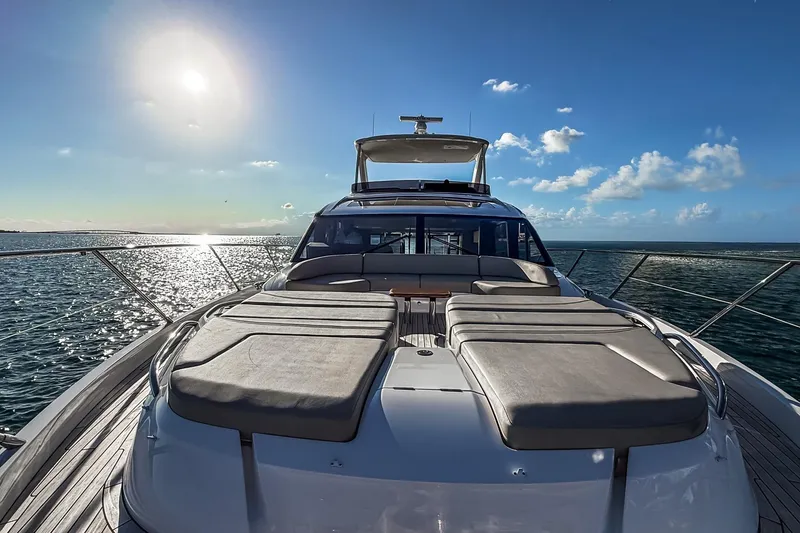 Slide: The Image of Luxurious 2026 Princess S65 Sportbridge yacht on open sea under clear blue sky. - 78