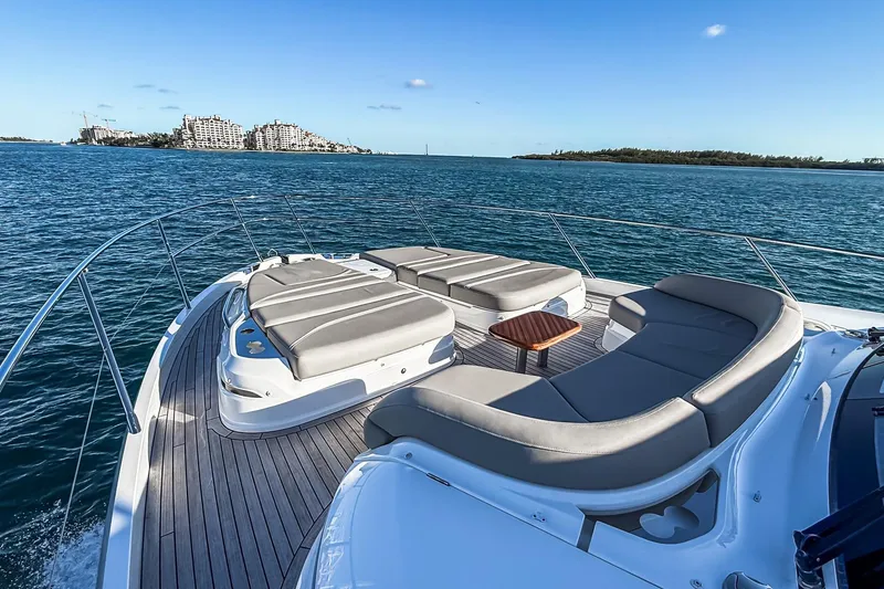 Slide: The Image of Luxurious 2026 Princess S65 Sportbridge yacht with sun loungers on open sea. - 86