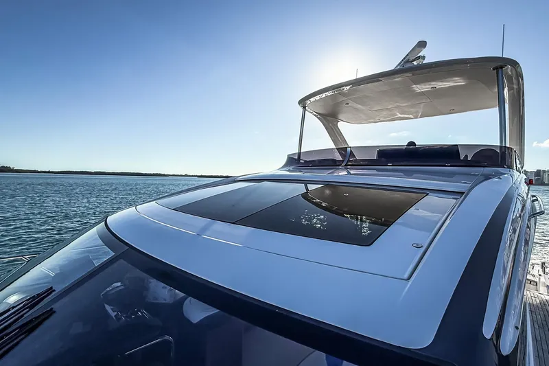 Slide: The Image of Luxurious 2026 Princess S65 Sportbridge yacht on serene water under clear sky. - 94