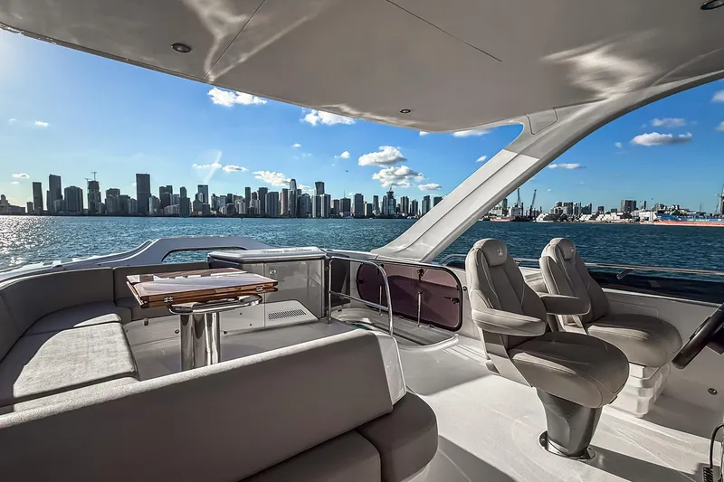 Slide: The Image of Luxurious 2026 Princess S65 Sportbridge yacht interior with city skyline view. - 95