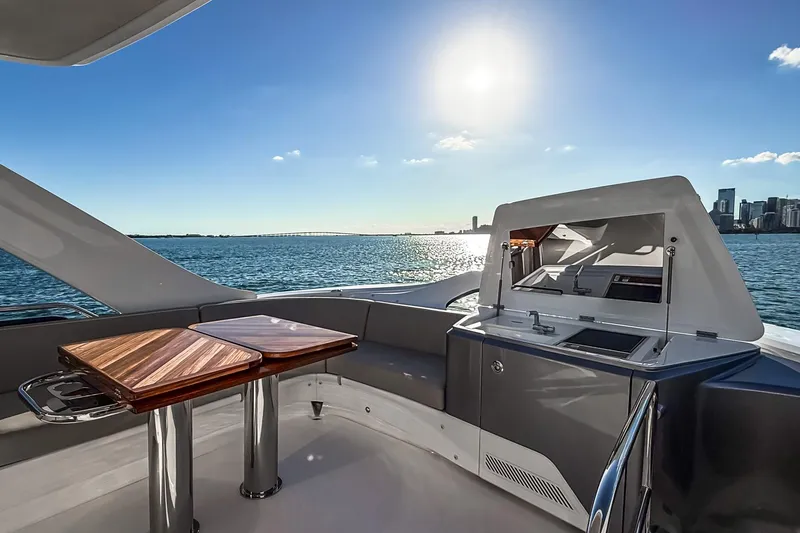 Slide: The Image of Luxurious 2026 Princess S65 Sportbridge yacht with elegant deck and stunning ocean view. - 99