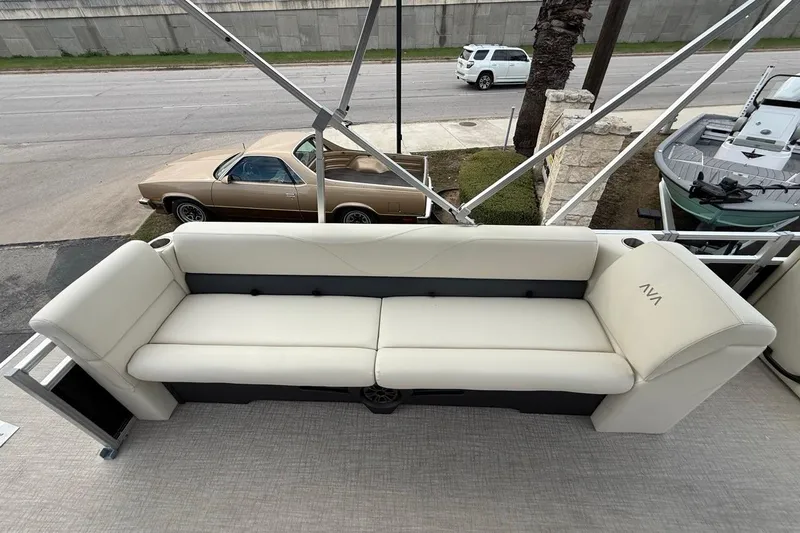 Slide: The Image of 2026 Avalon VLS Quad Lounge with cream seating on a boat deck. - 11