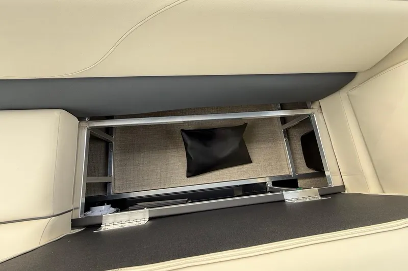 Slide: The Image of 2026 Avalon VLS Quad Lounge interior storage compartment with beige seating and metal frame. - 13