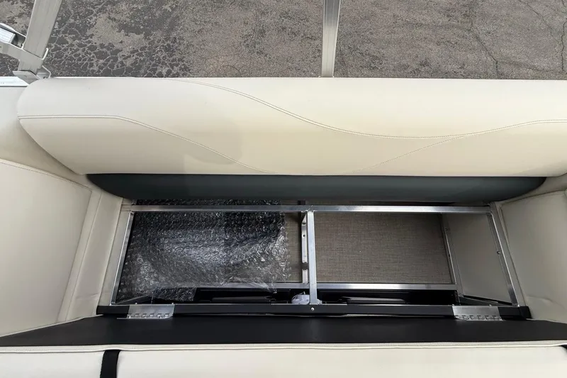 Slide: The Image of 2026 Avalon VLS Quad Lounge seat storage compartment, open view. - 16
