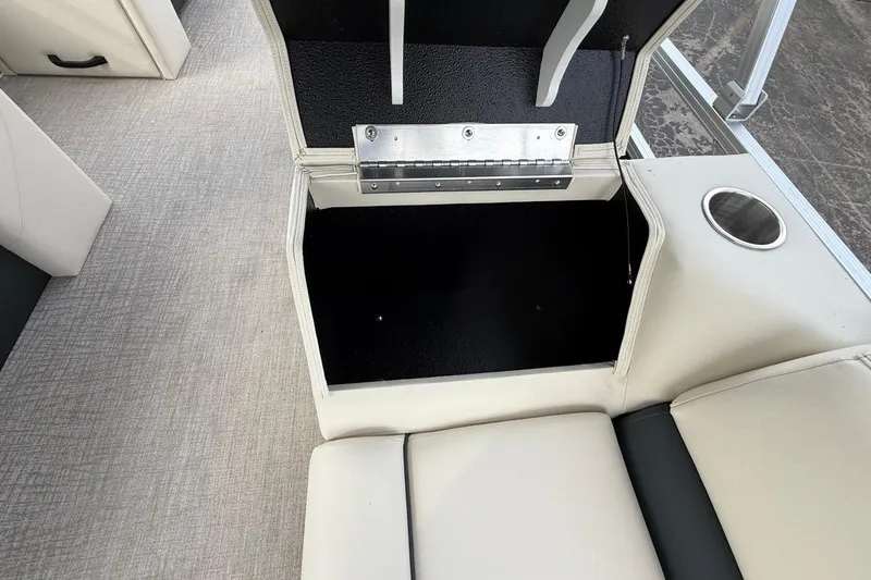 Slide: The Image of Avalon VLS Quad Lounge 2026 boat seat storage compartment with cup holder. - 17