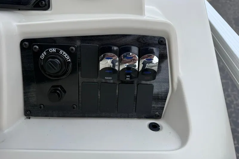 Slide: The Image of Control panel of 2026 Avalon VLS Quad Lounge boat with switches and start button. - 25