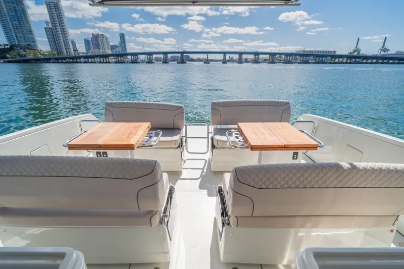 Slide: The Image of Luxurious Catana YOT 36 yacht interior with waterfront cityscape, 2025 model. - 12