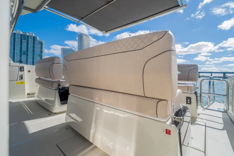 Slide: The Image of Luxurious seating on 2025 Catana YOT 36 yacht with city skyline backdrop. - 13
