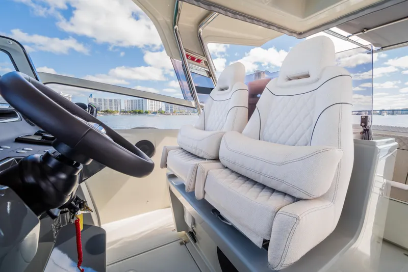 Slide: The Image of Luxurious interior of 2025 Catana YOT 36 boat with plush seating and modern steering. - 21