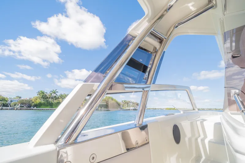 Slide: The Image of Catana YOT 36 boat interior with chrome details, overlooking a scenic waterfront. - 26