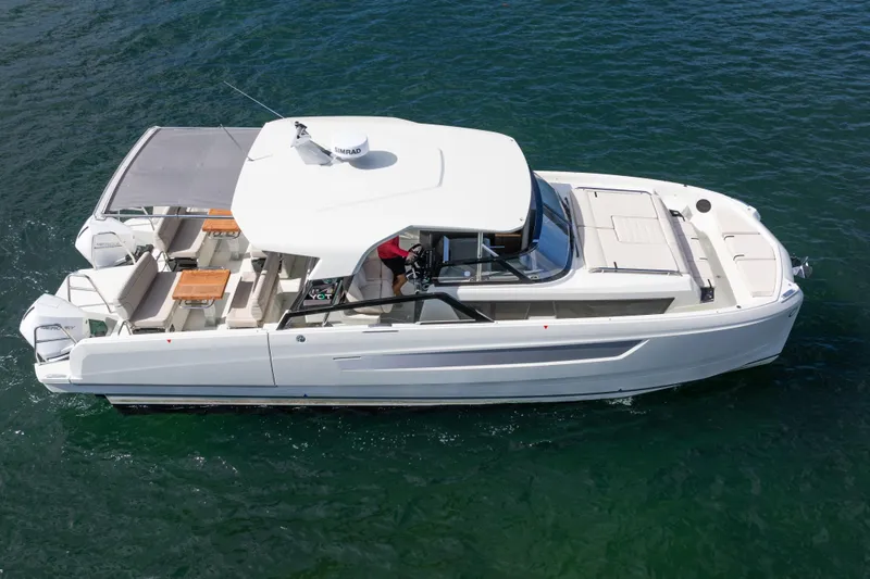 Slide: The Image of 2025 Catana YOT 36 luxury yacht cruising on open water, featuring spacious deck and modern design. - 3