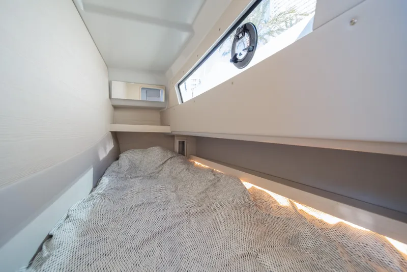 Slide: The Image of Interior cabin of 2025 Catana YOT 36, featuring a cozy bed and window. - 30