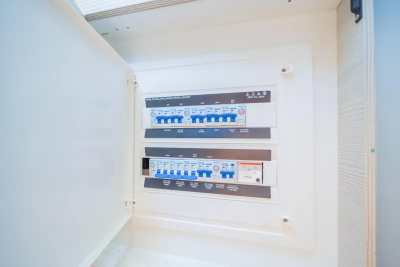 Slide: The Image of Electrical panel inside 2025 Catana YOT 36, showcasing circuit breakers and controls. - 31