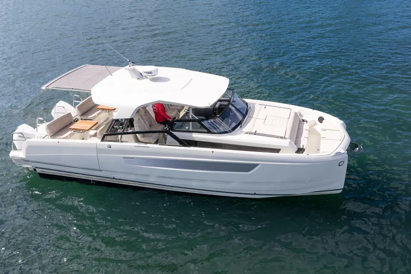 Slide: The Image of 2025 Catana YOT 36 luxury yacht on calm blue water, showcasing sleek design and spacious deck. - 4