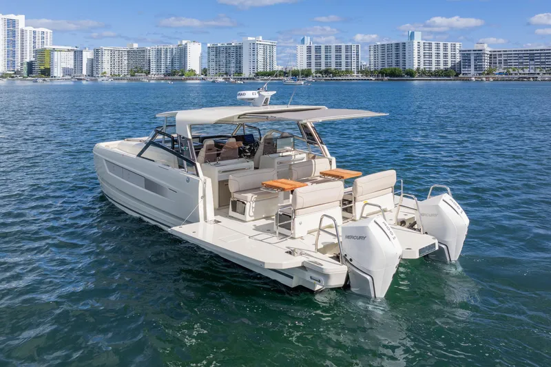 Slide: The Image of 2025 Catana YOT 36 motor yacht on water, city skyline in background. - 7