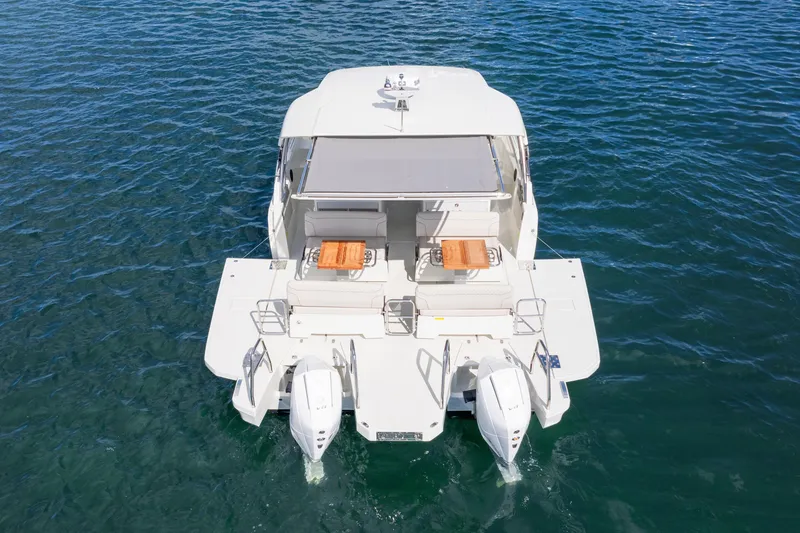 Slide: The Image of 2025 Catana YOT 36 catamaran on water, rear view with twin engines. - 8