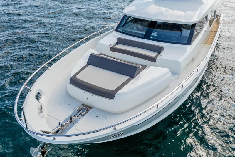 Slide: The Image of 2021 Ocean Alexander 70E Motoryacht on water, featuring sleek design and spacious deck. - 13