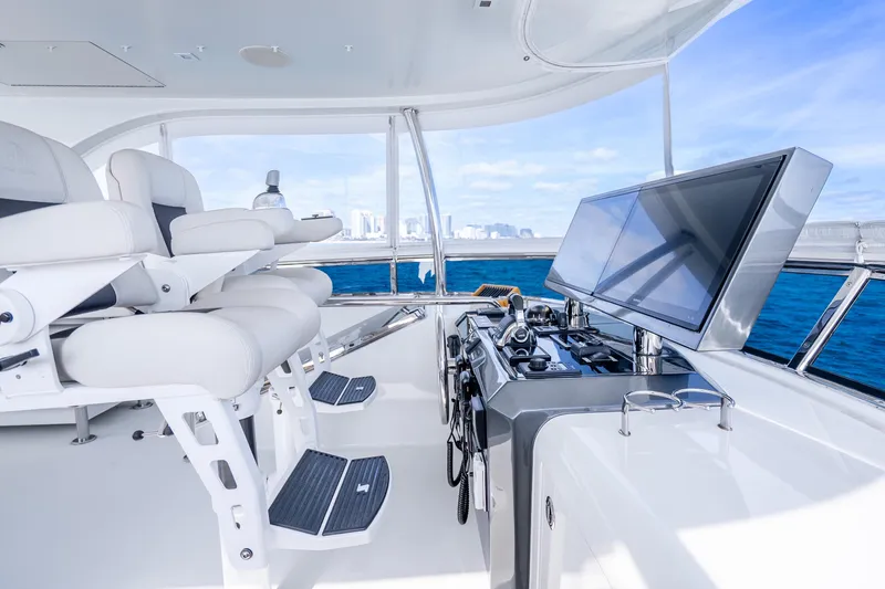 Slide: The Image of Luxurious helm of 2021 Ocean Alexander 70E Motoryacht with modern controls and ocean view. - 20