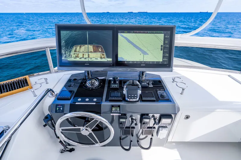 Slide: The Image of Helm of 2021 Ocean Alexander 70E Motoryacht with navigation screens and controls. - 22