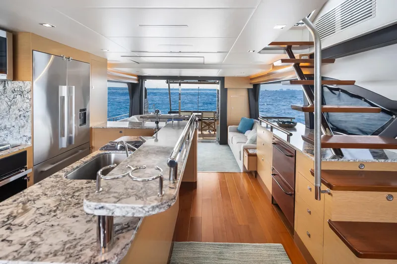 Slide: The Image of Luxurious interior of 2021 Ocean Alexander 70E Motoryacht with modern kitchen and ocean view. - 32