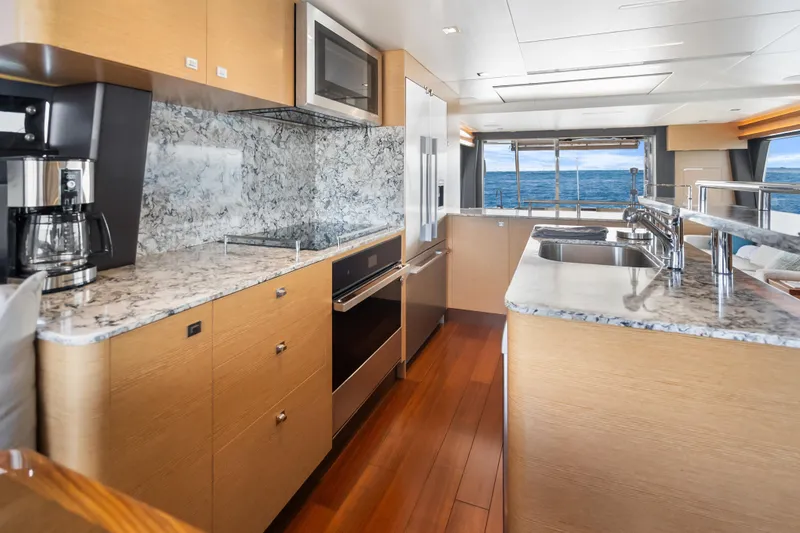 Slide: The Image of Luxurious kitchen interior of 2021 Ocean Alexander 70E Motoryacht with ocean view. - 33