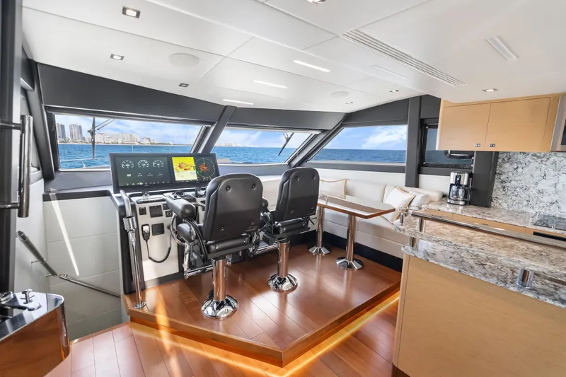 Slide: The Image of Luxurious interior of 2021 Ocean Alexander 70E Motoryacht with modern helm and ocean view. - 34
