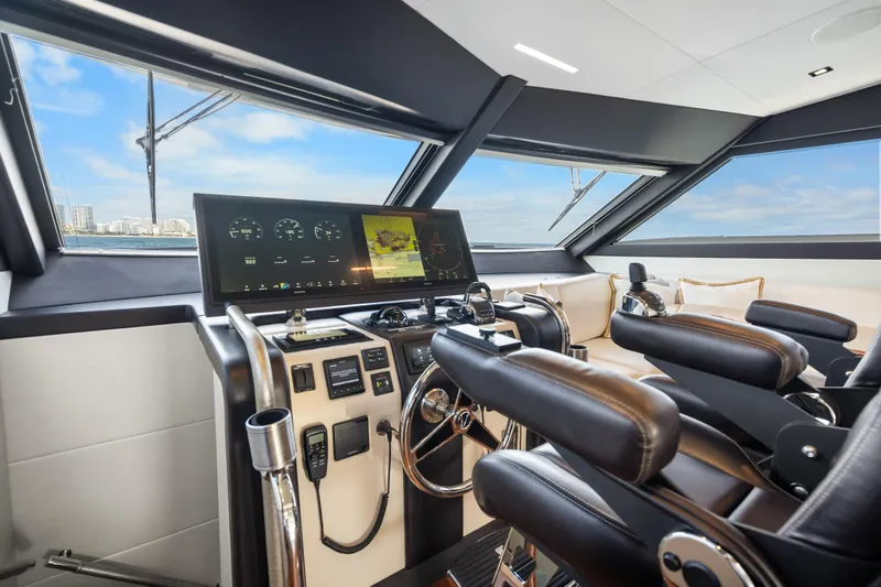 Slide: The Image of 2021 Ocean Alexander 70E Motoryacht helm with modern controls and panoramic windows. - 37