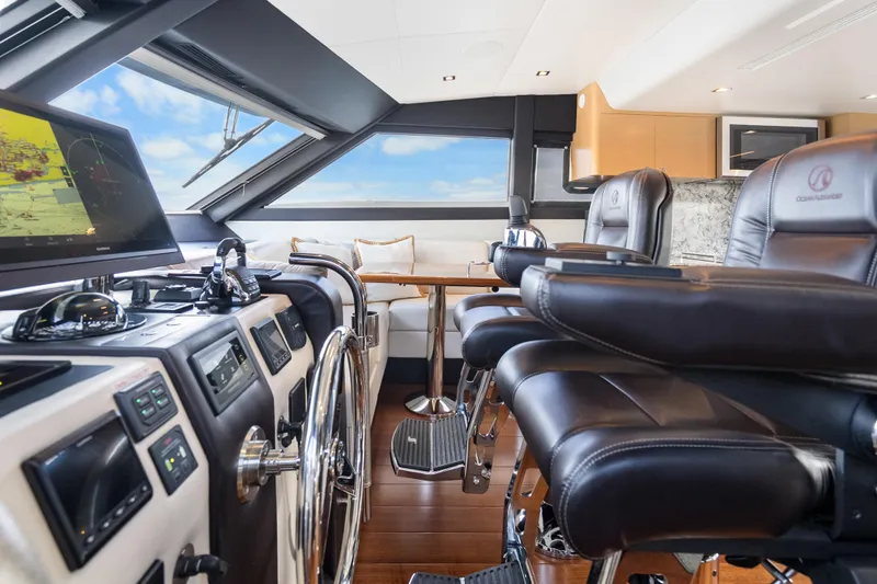 Slide: The Image of Luxurious helm of 2021 Ocean Alexander 70E Motoryacht with leather seating and advanced navigation. - 38