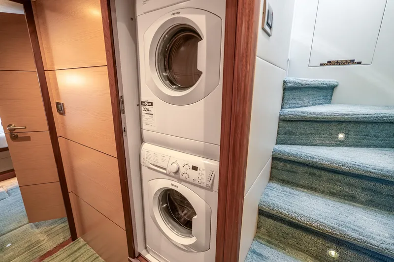Slide: The Image of Laundry area in 2021 Ocean Alexander 70E Motoryacht with stacked washer and dryer. - 40