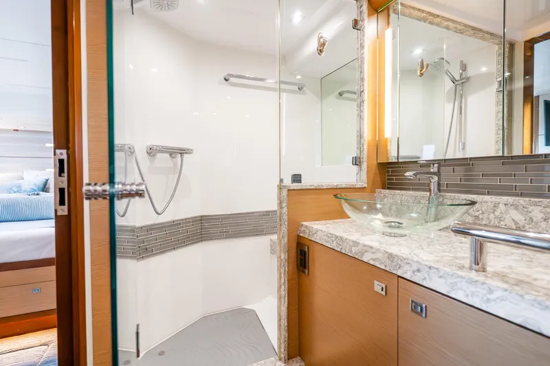 Slide: The Image of Luxurious bathroom in 2021 Ocean Alexander 70E Motoryacht with glass sink and modern shower. - 45