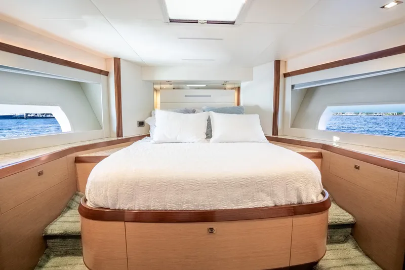 Slide: The Image of Luxurious bedroom interior of 2021 Ocean Alexander 70E Motoryacht with ocean view windows. - 46