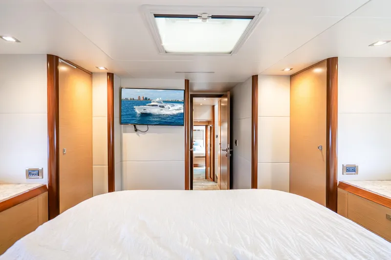 Slide: The Image of Luxurious bedroom interior of 2021 Ocean Alexander 70E Motoryacht with TV and skylight. - 47