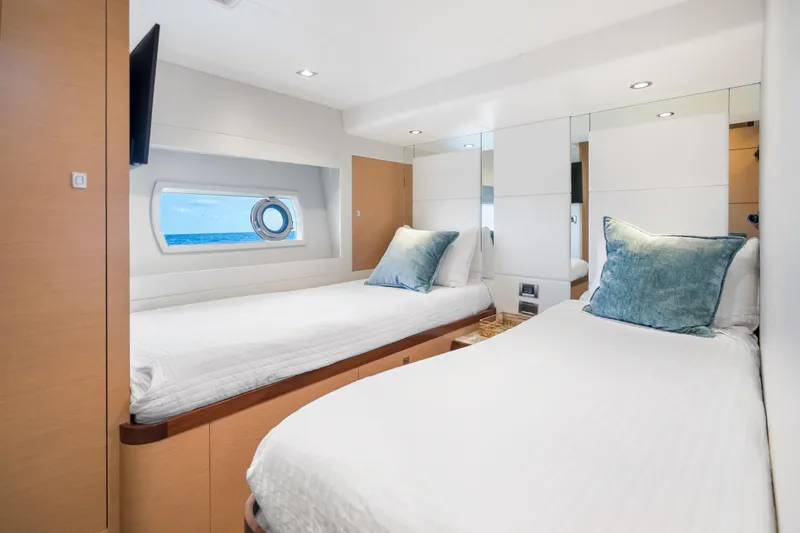 Slide: The Image of Interior of 2021 Ocean Alexander 70E Motoryacht with twin beds and ocean view. - 50