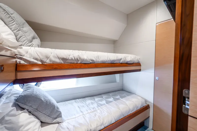 Slide: The Image of 2021 Ocean Alexander 70E Motoryacht cabin with cozy bunk beds and modern design. - 53