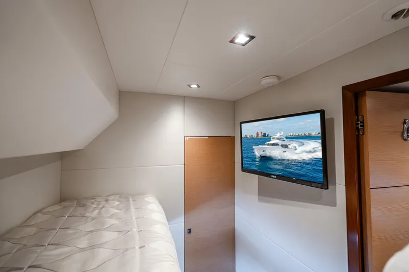 Slide: The Image of Interior cabin of 2021 Ocean Alexander 70E Motoryacht with TV and bunk bed. - 54