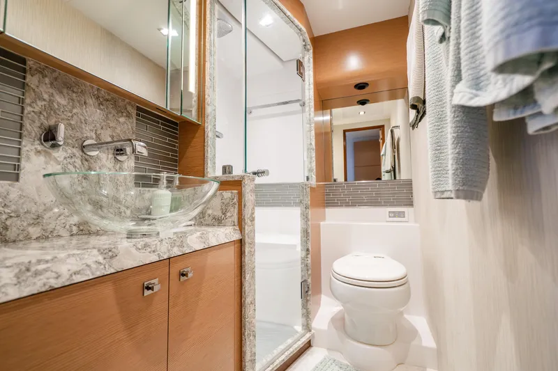 Slide: The Image of Luxurious bathroom in 2021 Ocean Alexander 70E Motoryacht with modern fixtures and elegant design. - 55