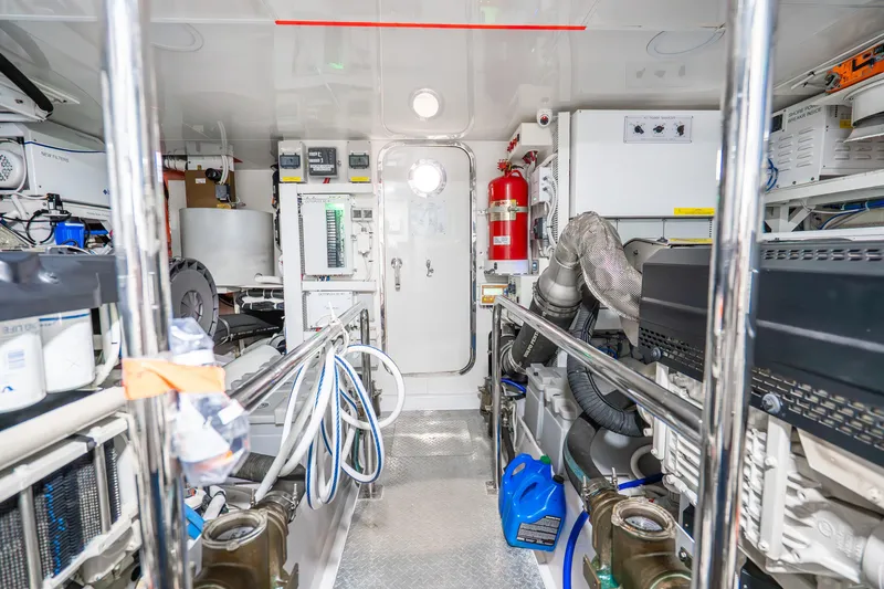 Slide: The Image of Engine room of 2021 Ocean Alexander 70E Motoryacht, featuring advanced equipment and safety systems. - 61