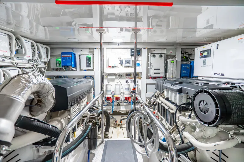 Slide: The Image of Engine room of 2021 Ocean Alexander 70E Motoryacht, featuring advanced machinery and equipment. - 62