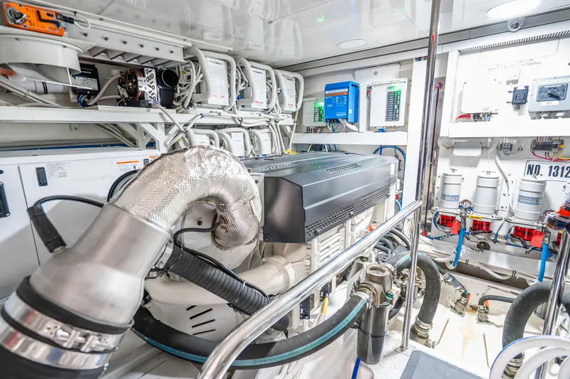 Slide: The Image of Engine room of 2021 Ocean Alexander 70E Motoryacht, showcasing advanced machinery and systems. - 64